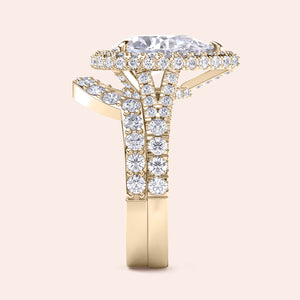 Yellow gold pear diamond halo engagement ring set side view, pavé band and matching wedding ring, luxury bridal set 