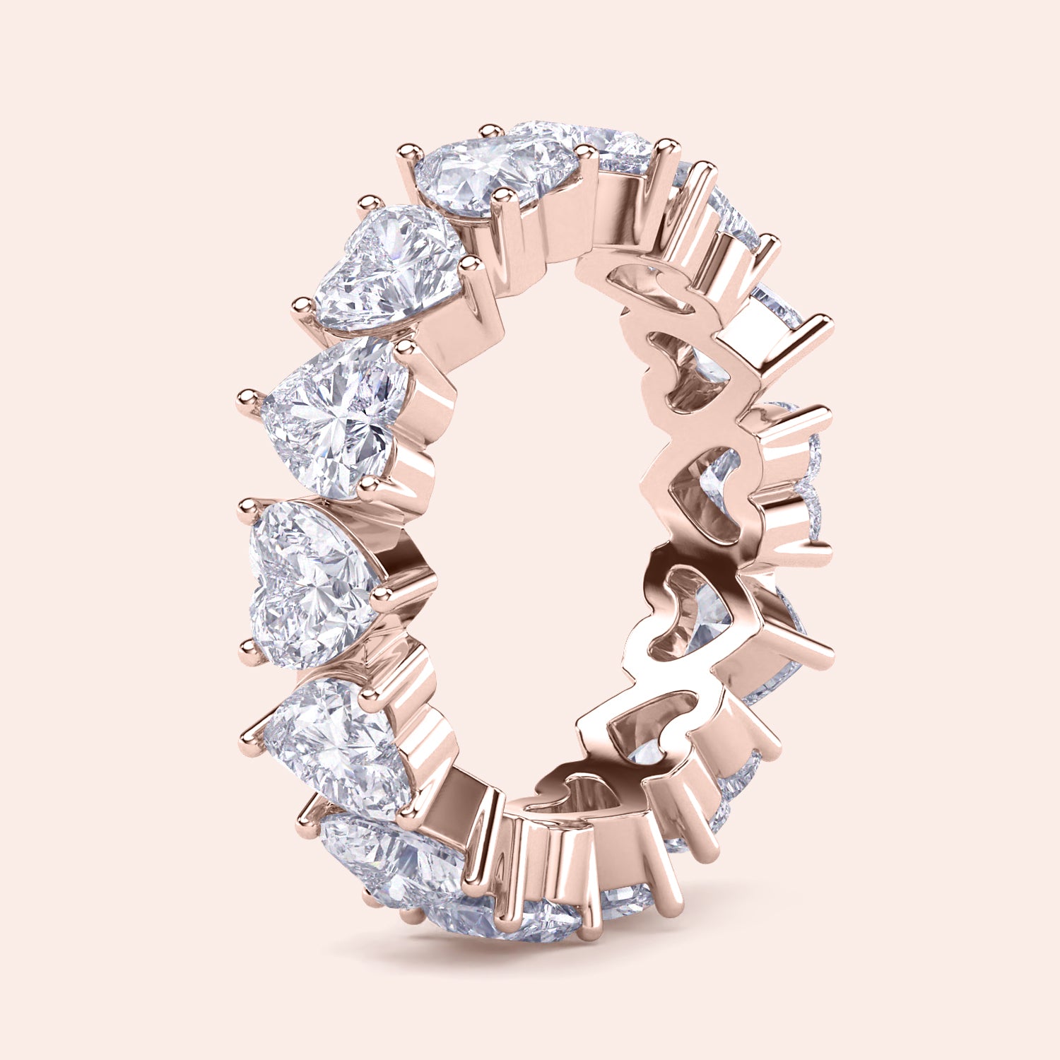 Heart diamond eternity band in rose gold, side perspective showing elevated setting, prongs and depth of diamond placement | 

#14KRecycledRoseGold #18KRecycledRoseGold