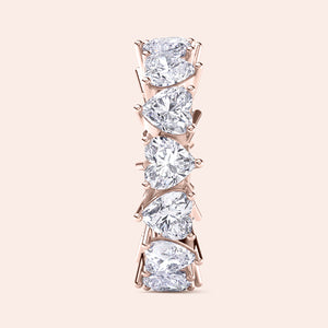Heart diamond eternity band in rose gold, side perspective showing elevated setting, prongs and depth of diamond placement 