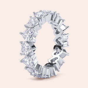 Heart cut diamond eternity band in white gold, vertical composition showcasing continuous design and high diamond brilliance 