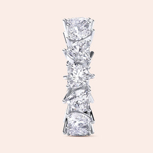 White gold heart diamond eternity ring, side profile showing elevated prong setting, structure and depth of the design 