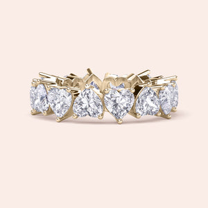 Heart diamond eternity band in yellow gold, front view displaying balanced symmetry and full circle diamond setting 
