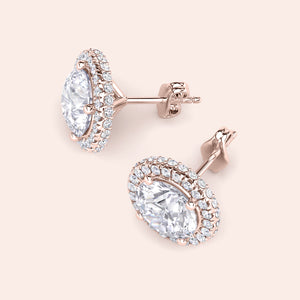Rose gold round halo diamond stud earrings, angled view highlighting halo setting, diamond brilliance and refined craftsmanship 