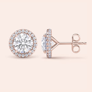 Signature round halo diamond stud earrings in rose gold, close-up front view showcasing brilliant center diamonds surrounded by a sparkling halo 