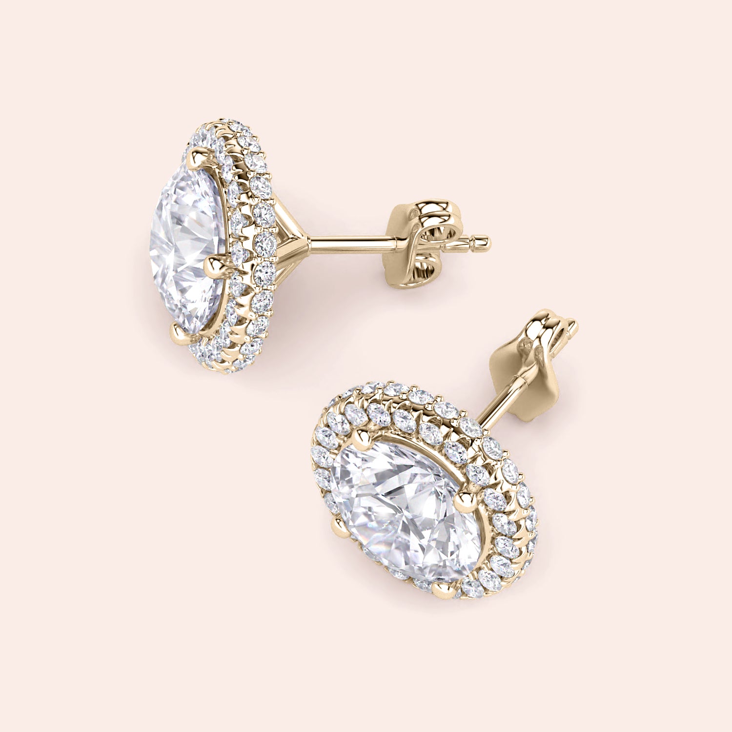 Yellow gold halo diamond stud earrings worn on ear, lifestyle close-up highlighting sparkle, elegance and everyday luxury appeal | #14KRecycledYellowGold #18KRecycledYellowGold

