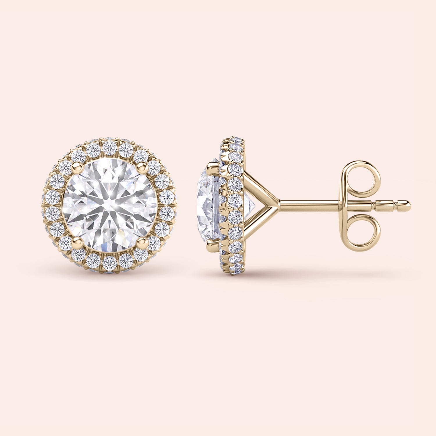 Signature round halo diamond stud earrings in yellow gold, close-up front view showcasing brilliant center diamonds surrounded by a sparkling halo | 
#14KRecycledYellowGold #18KRecycledYellowGold
