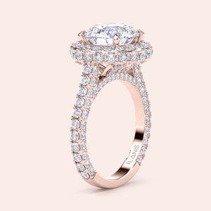 Round halo diamond engagement ring in recycled rose gold, side view showing pavé shank and elevated halo setting 