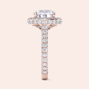 Round halo diamond engagement ring in recycled rose gold, side profile showing cat claw prongs and pavé band 
