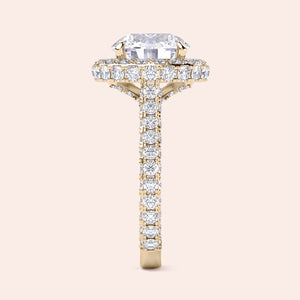 Round halo diamond engagement ring in yellow gold, side profile showing elevated setting and pavé band 