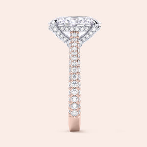 Two tone oval diamond engagement ring, profile view featuring hidden halo and diamond pavé band in mixed metals 