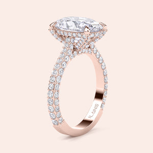 Oval diamond engagement ring in rose gold, side profile with pavé band and hidden halo setting 