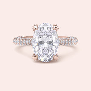 Oval diamond engagement ring in rose gold, top view with pavé band and solitaire setting 