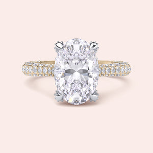 Two tone yellow and white gold oval engagement ring, front view with white gold prongs and yellow gold diamond band 