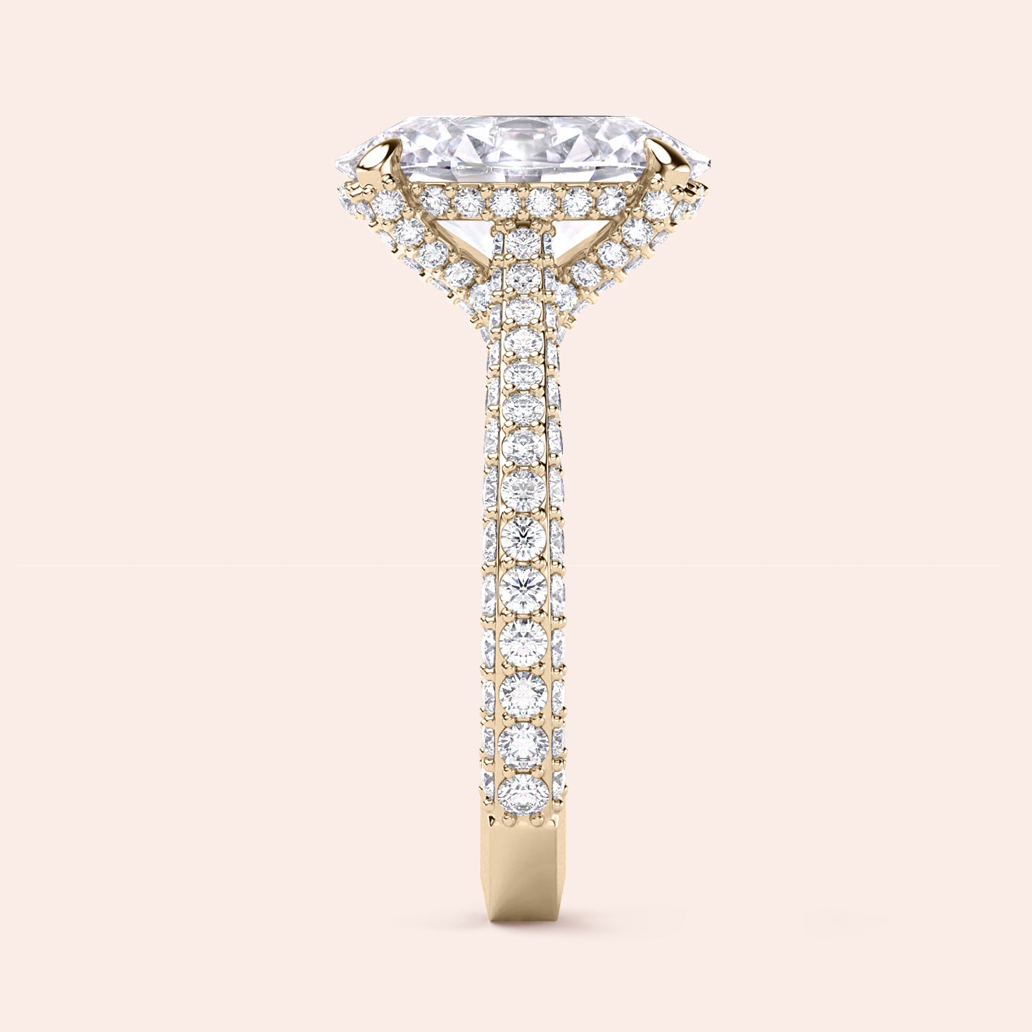 Yellow gold oval diamond engagement ring, profile view featuring hidden halo and diamond pavé band | #14KRecycledYellowGold #18KRecycledYellowGold