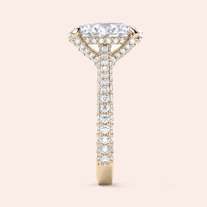 Yellow gold oval diamond engagement ring, profile view featuring hidden halo and diamond pavé band 
