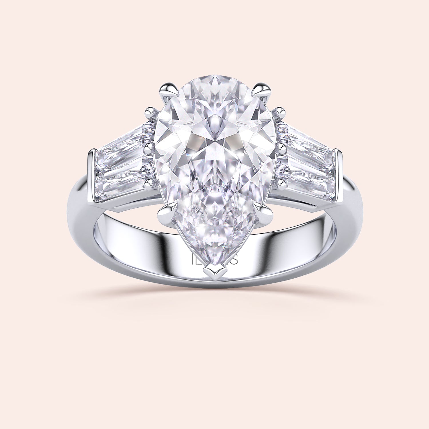Pear shaped diamond engagement ring in white gold with tapered baguette side stones, classic three stone design with brilliant center diamond | #14KRecycledWhiteGold #18KRecycledWhiteGold 
#Platinum