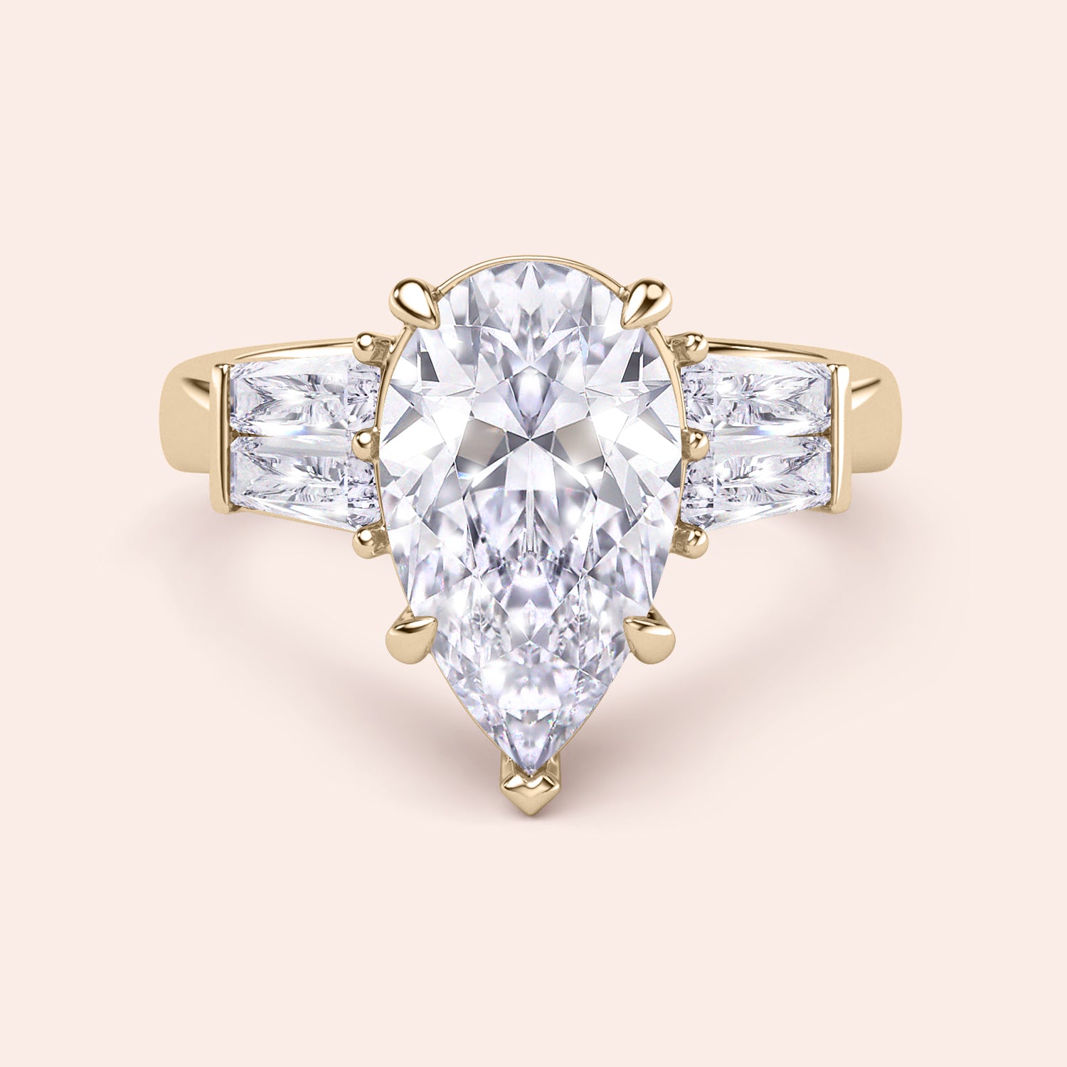 Pear shaped diamond engagement ring in yellow gold with tapered baguette side stones, classic three stone design with brilliant center diamond | #14KRecycledYellowGold #18KRecycledYellowGold