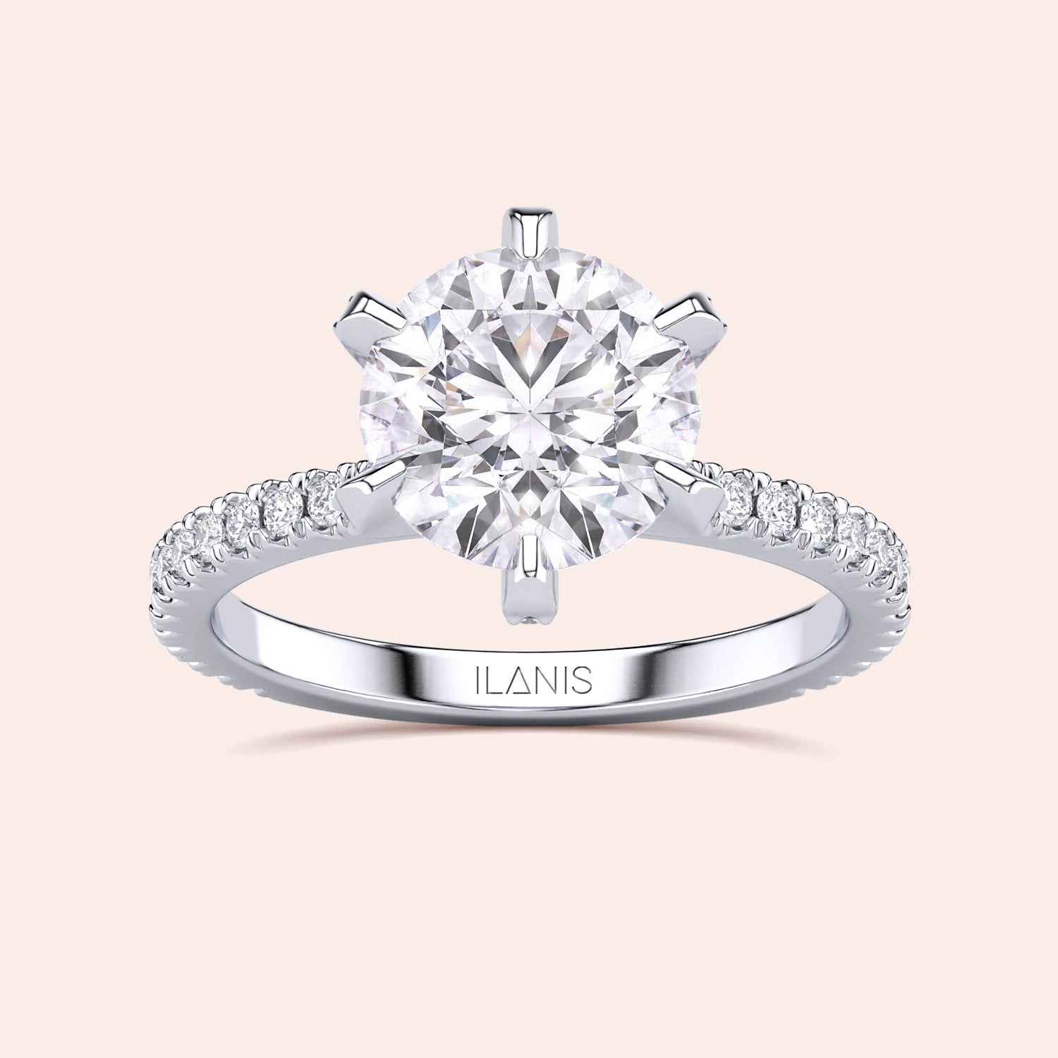 Top view close-up of white gold or platinum round diamond engagement ring with pavé band, emphasizing cut precision, sparkle and prong accents | #14KRecycledWhiteGold #18KRecycledWhiteGold #Platinum