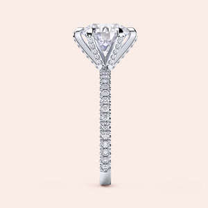 White gold or platinum diamond engagement ring side profile showing pavé band, accent diamond prongs and elevated gallery design 