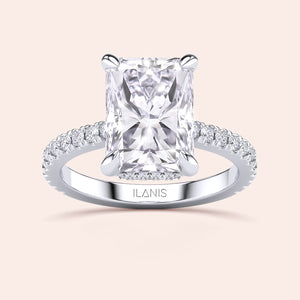 Top view close-up of radiant cut diamond engagement ring in white gold with pavé band, showcasing cut precision, sparkle and refined prongs 