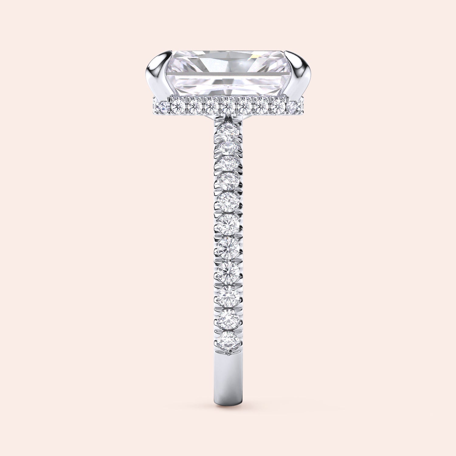 Side profile of white gold radiant cut diamond engagement ring with pavé band and accent diamonds on prongs, showcasing elevated gallery and craftsmanship | #14KRecycledWhiteGold #18KRecycledWhiteGold #Platinum