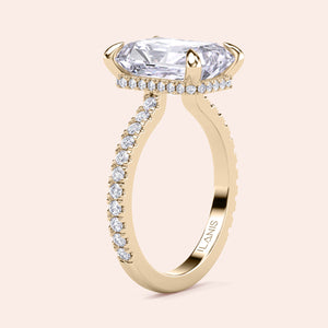 Vertical side view of yellow gold radiant cut diamond engagement ring with pavé band, showcasing craftsmanship, structure and fine diamond setting 