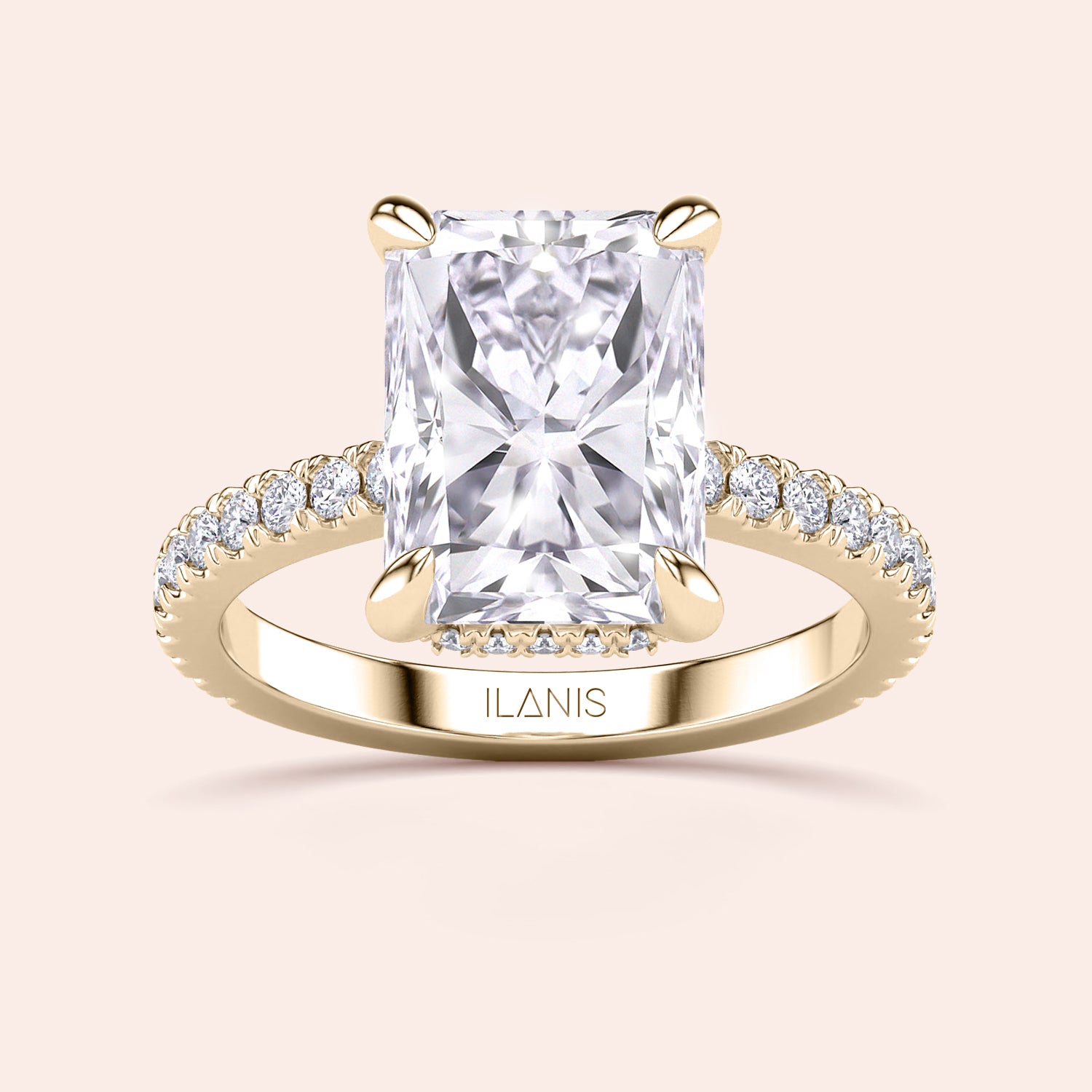 Top view close-up of radiant cut diamond engagement ring in yellow gold with pavé band, emphasizing cut precision, fire and prong detailing | #14KRecycledYellowGold #18KRecycledYellowGold