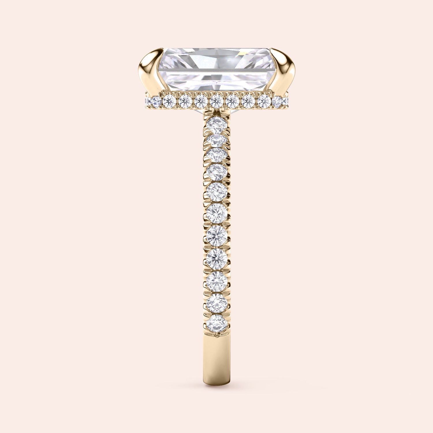 Side profile of yellow gold radiant cut diamond engagement ring with pavé band and accent diamonds on prongs, showing elevated gallery design | #14KRecycledYellowGold #18KRecycledYellowGold