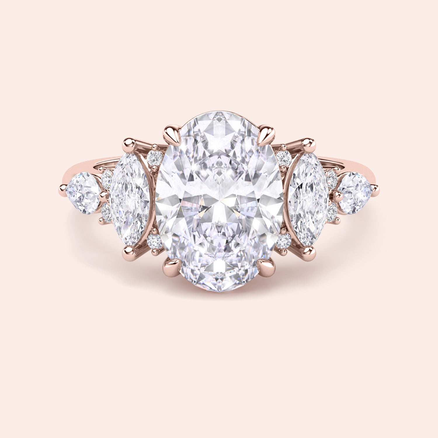 Oval diamond engagement ring yellow gold top view with pear side stones, high clarity oval cut center stone, fine jewelry engagement ring close up | #14KRecycledRoseGold #18KRecycledRoseGold