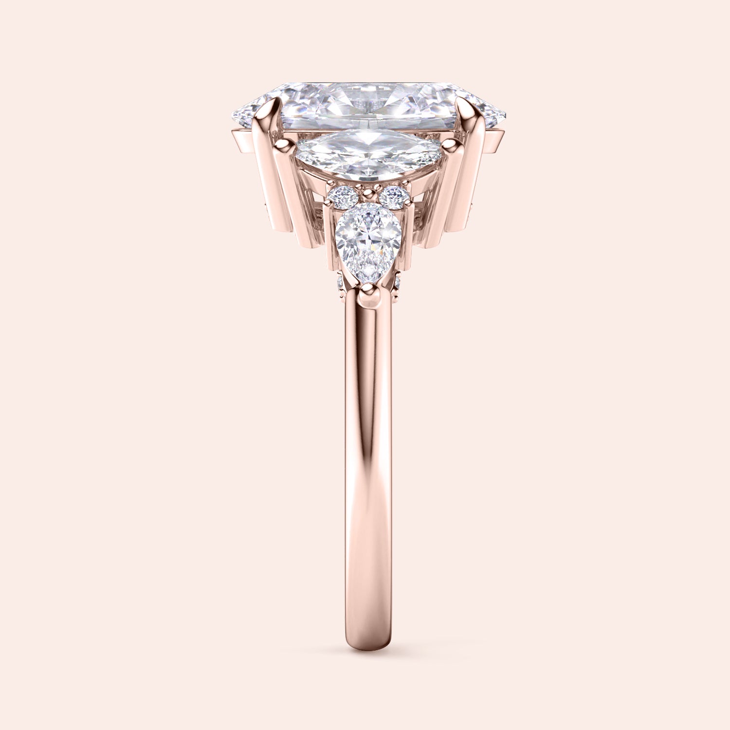 Rose gold oval three stone diamond engagement ring vertical side view with pear side stones, detailed craftsmanship and premium bridal design | #14KRecycledRoseGold #18KRecycledRoseGold