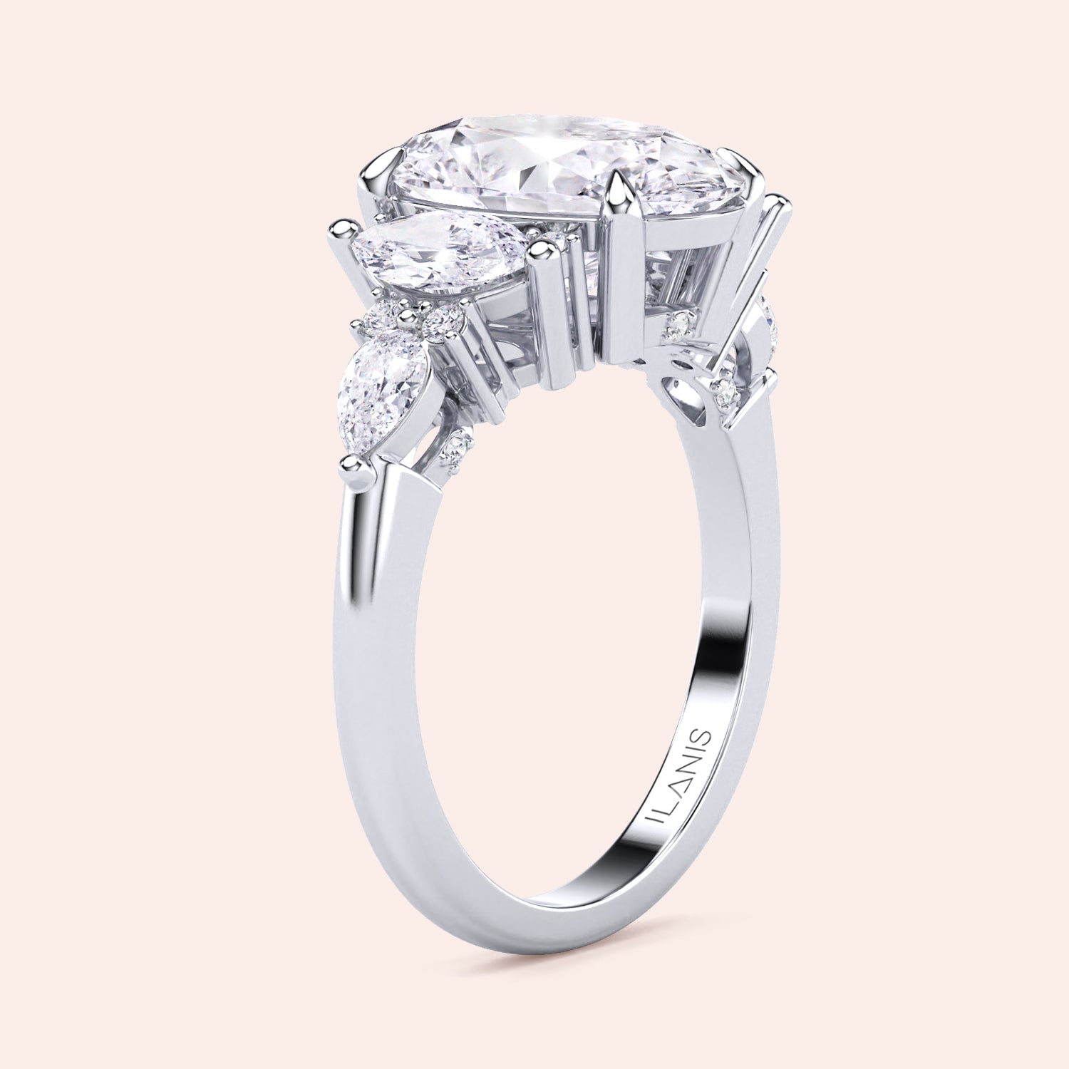 White gold oval three stone diamond engagement ring vertical side view with pear side stones, structured gallery and elegant craftsmanship | #14KRecycledWhiteGold #18KRecycledWhiteGold #Platinum