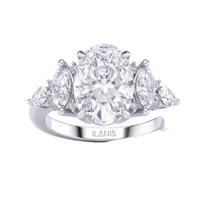 White gold oval diamond engagement ring top view with pear side stones, precision cut oval center diamond, fine jewelry close up 