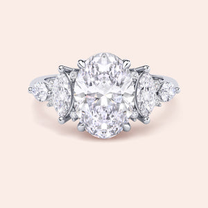 Oval cut three stone diamond engagement ring white gold front view with pear side stones, high brilliance oval center stone, premium bridal jewelry 