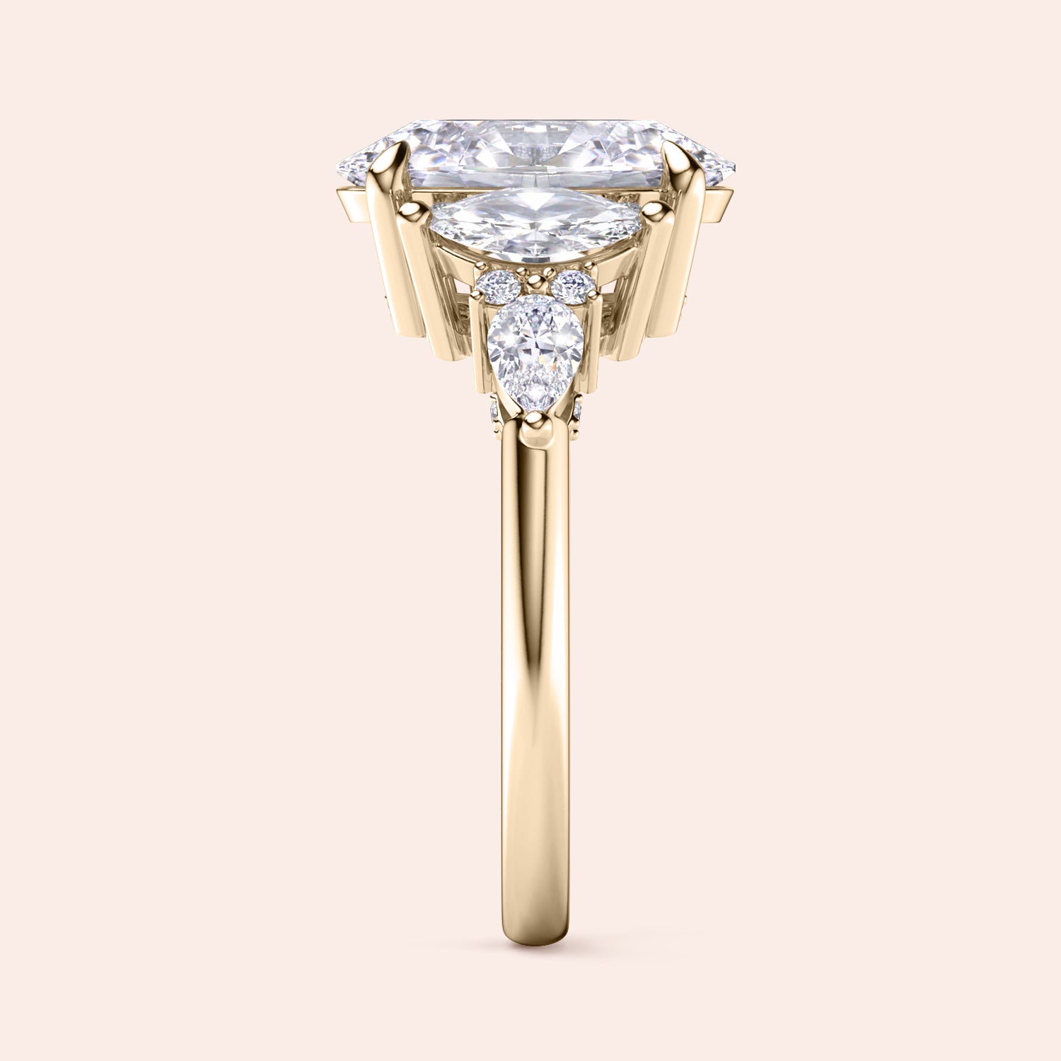 Oval cut three stone diamond engagement ring yellow gold front view with pear side stones, brilliant oval center diamond, luxury bridal ring design | #14KRecycledYellowGold #18KRecycledYellowGold