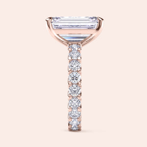 Emerald cut diamond ring rose gold vertical side view with pavé eternity band, refined setting details and handcrafted fine jewelry 