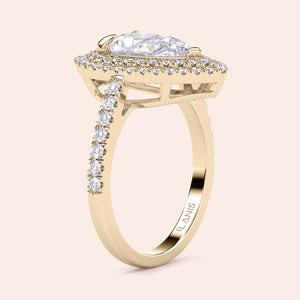 Pear diamond engagement ring yellow gold with pavé band and halo setting, detailed craftsmanship, elegant side view 