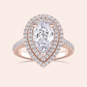 Rose gold pear shaped diamond ring with double halo and pavé band, bold center stone with layered halo detail, fine jewelry engagement ring 