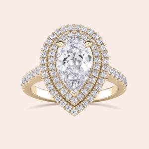 Pear diamond halo engagement ring in yellow gold, double halo setting with brilliant pavé diamonds, statement bridal ring design 