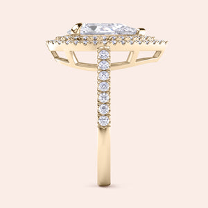 Pear shaped diamond engagement ring yellow gold with double halo and pavé band, side profile view, elevated hidden setting, luxury bridal ring 