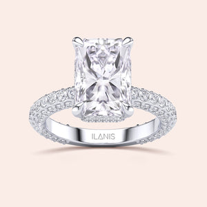 Radiant cut diamond engagement ring white gold with pavé band, four prong setting, high brilliance rectangular center stone 