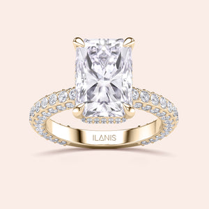 Radiant cut diamond engagement ring yellow gold with pavé band, four prong setting, brilliant rectangular center stone 