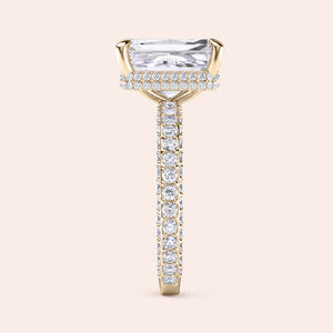 Radiant cut diamond ring yellow gold with pavé band, elevated setting showcasing refined craftsmanship and detail 