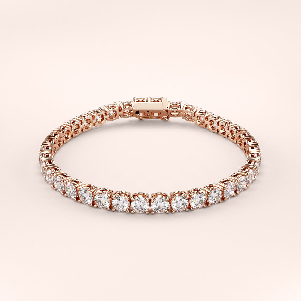 Elegant diamond tennis bracelet featuring round brilliant cut diamonds in a secure four-prong setting. Available in 14K or 18K white, yellow, or rose gold. Timeless luxury and radiant sparkle for any occasion. 