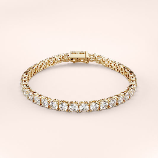Elegant diamond tennis bracelet featuring round brilliant cut diamonds in a secure four-prong setting. Available in 14K or 18K white, yellow, or rose gold. Timeless luxury and radiant sparkle for any occasion. 
