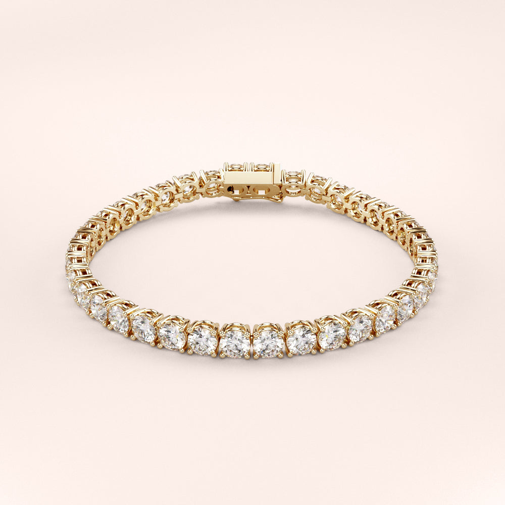 Elegant diamond tennis bracelet featuring round brilliant cut diamonds in a secure four-prong setting. Available in 14K or 18K white, yellow, or rose gold. Timeless luxury and radiant sparkle for any occasion. 