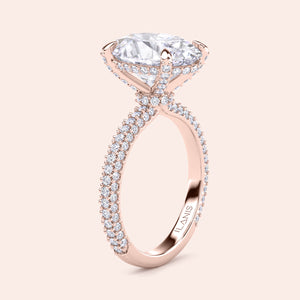 Oval diamond engagement ring in rose gold with hidden halo and pavé band, side profile showcasing elevated setting and diamond-encrusted gallery 