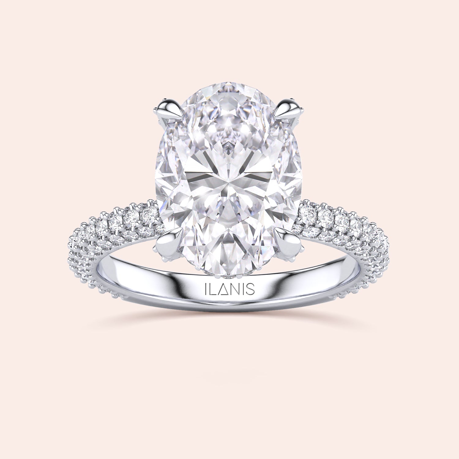 Pear shaped diamond ring in white gold, top view highlighting brilliance of center stone and symmetry of baguette side diamonds | #14KRecycledWhiteGold #18KRecycledWhiteGold #Platinum