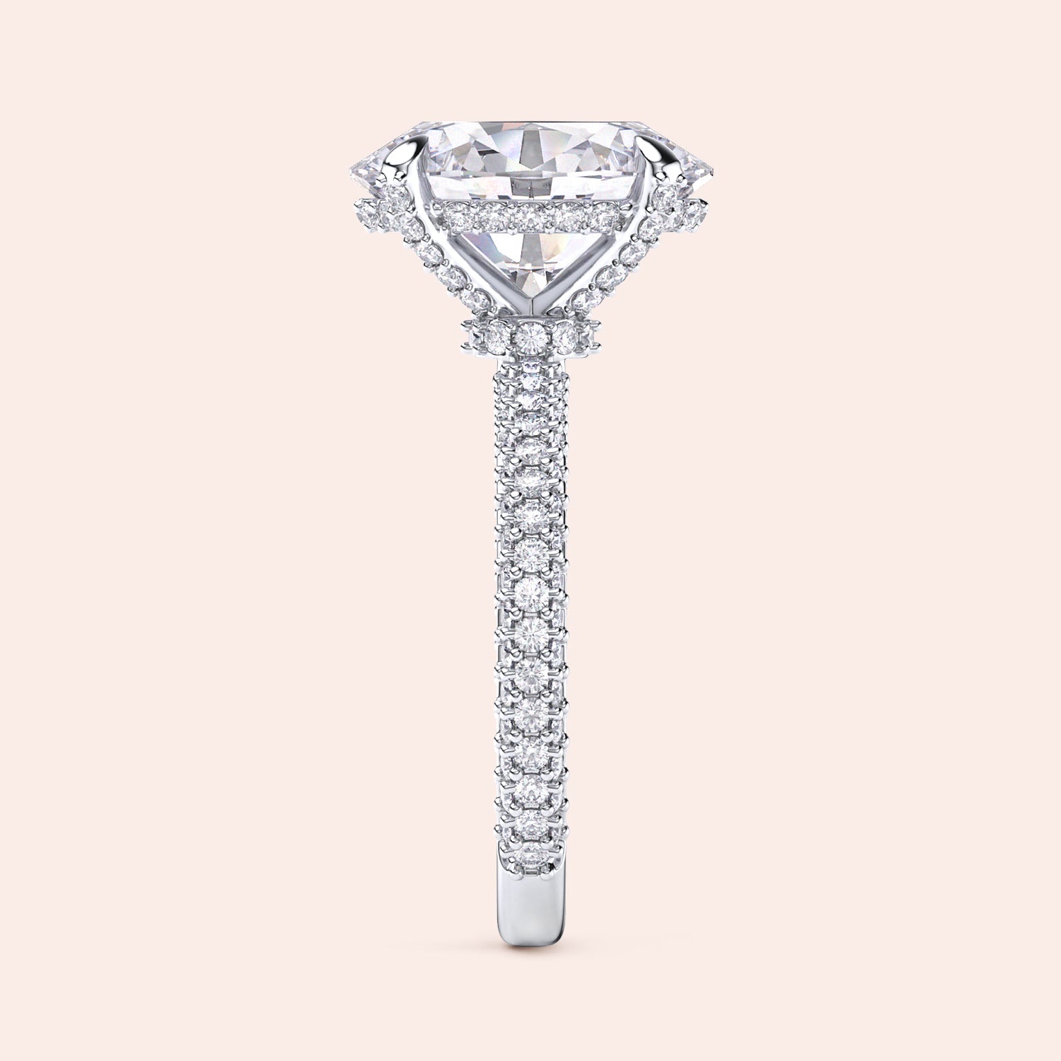 Pear shaped diamond engagement ring in white gold with three stone setting and tapered baguette side diamonds, side profile showcasing elevated setting and fine craftsmanship | #14KRecycledWhiteGold #18KRecycledWhiteGold #Platinum