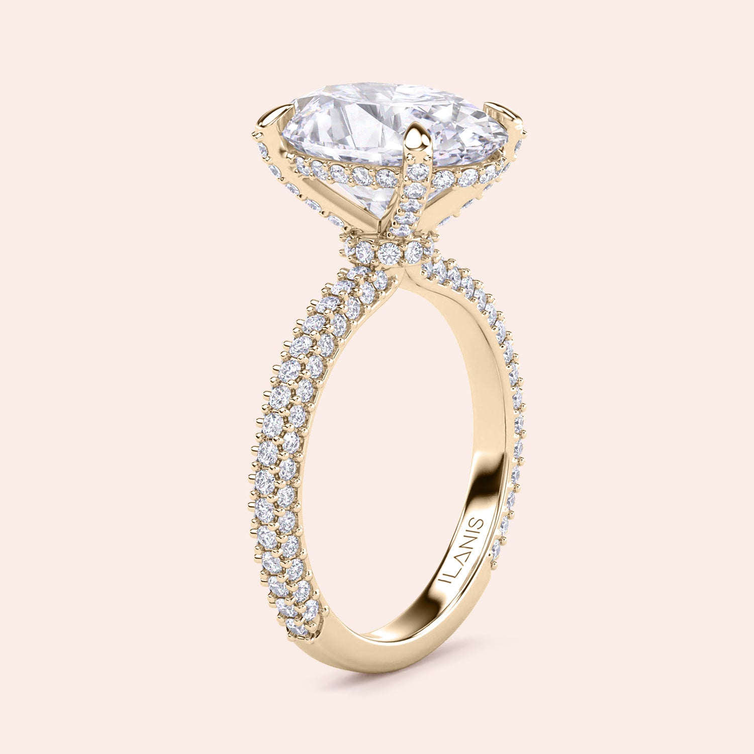 Pear shaped diamond engagement ring in yellow gold with three stone setting and tapered baguette side diamonds, side profile showcasing elevated setting and fine craftsmanship | #14KRecycledYellowGold #18KRecycledYellowGold