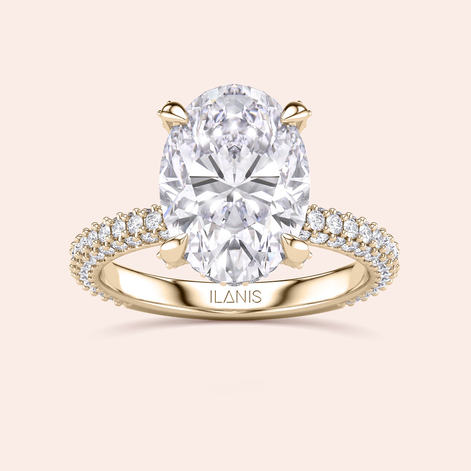 Pear shaped diamond ring in yellow gold, top view highlighting brilliance of center stone and symmetry of baguette side diamonds | #14KRecycledYellowGold #18KRecycledYellowGold